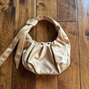Super cute, gold tie shoulder bag